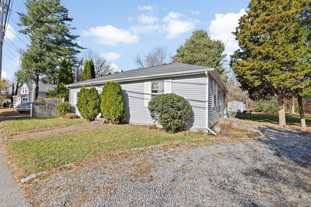 view of property exterior featuring a lawn