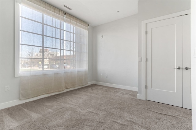 spare room with light carpet