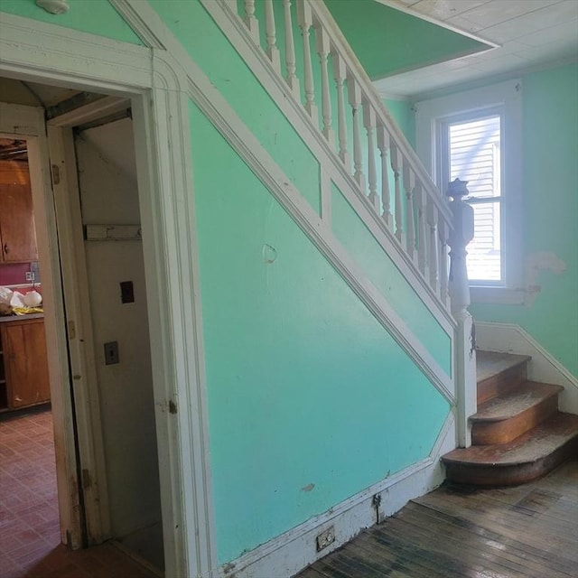 stairway with wood finished floors