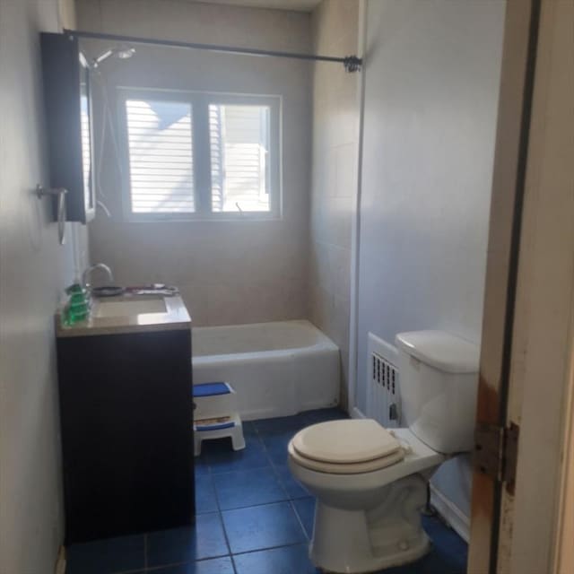 bathroom with vanity, tile patterned flooring, and toilet