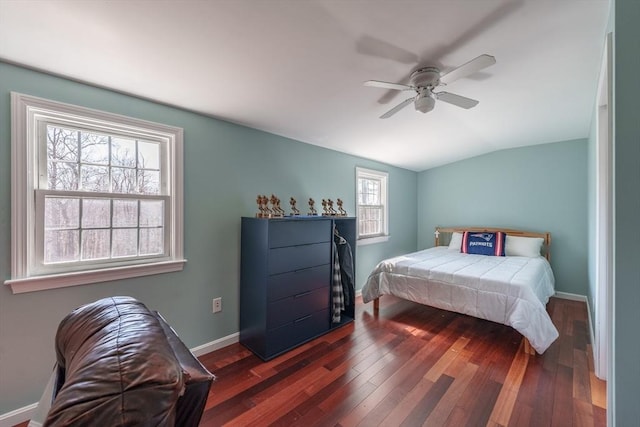 bedroom featuring wood-type flooring, baseboards, vaulted ceiling, and ceiling fan