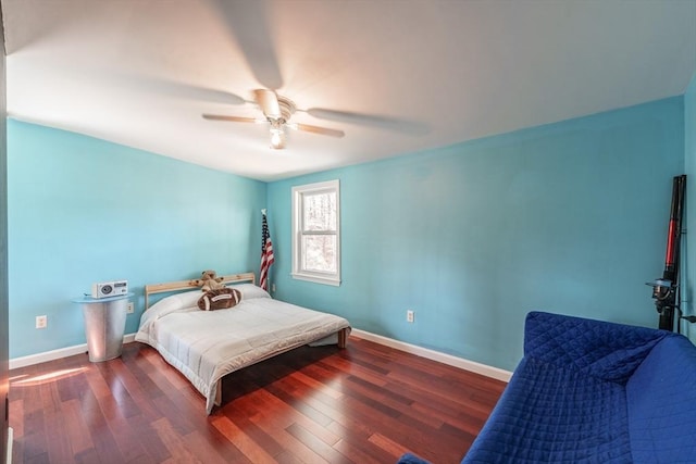 bedroom with wood finished floors, ceiling fan, and baseboards