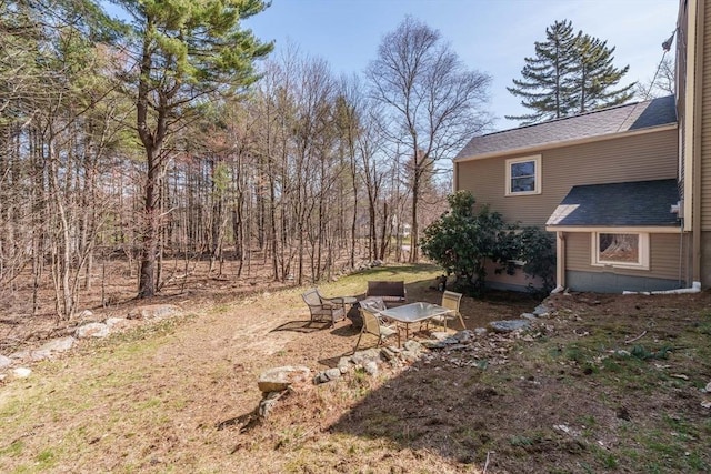view of yard with an outdoor fire pit