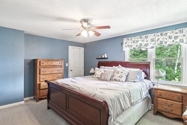 23 Jasmine Ct, Dracut, MA 01826 - bedroom featuring light colored carpet, a textured ceiling, a ceiling fan, and baseboards