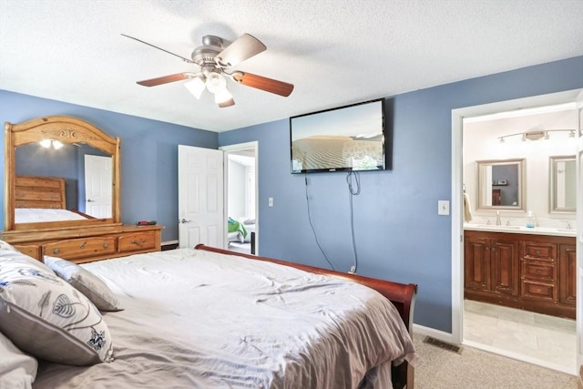 23 Jasmine Ct, Dracut, MA 01826 - bedroom featuring a sink, light colored carpet, baseboards, ensuite bathroom, and a ceiling fan