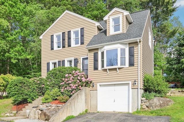 23 Jasmine Ct, Dracut, MA 01826 - view of front of house with driveway, an attached garage, and roof with shingles