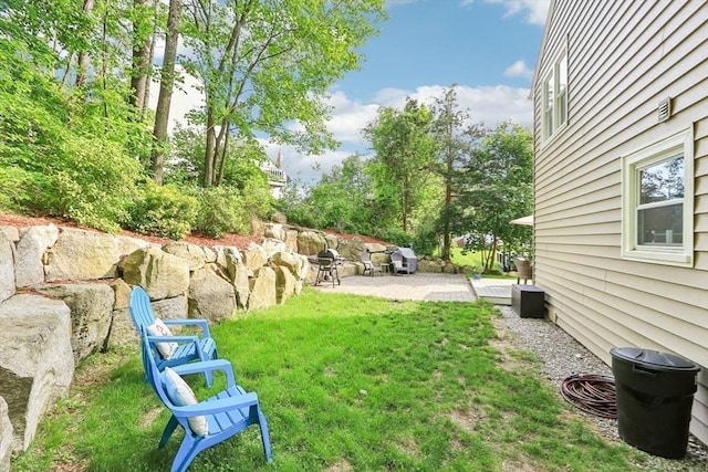 23 Jasmine Ct, Dracut, MA 01826 - view of green lawn featuring a patio area