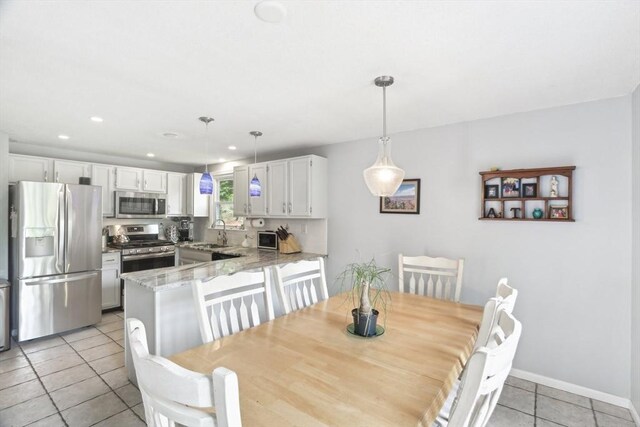 23 Jasmine Ct, Dracut, MA 01826 - dining space featuring light tile patterned flooring, baseboards, and recessed lighting