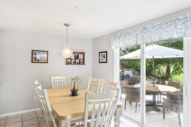 23 Jasmine Ct, Dracut, MA 01826 - dining area with light tile patterned floors and baseboards