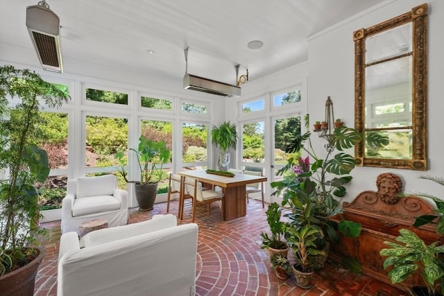 sunroom featuring a wall mounted AC