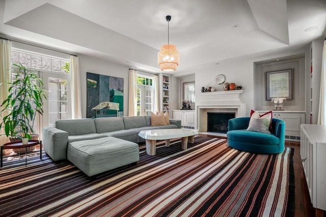 living room featuring a tray ceiling