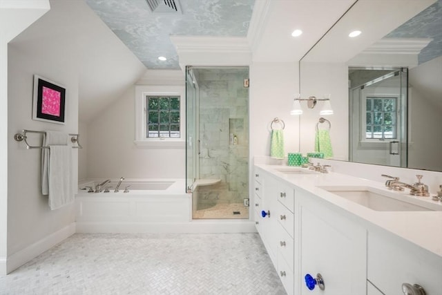 bathroom with vanity, vaulted ceiling, tile patterned floors, and separate shower and tub