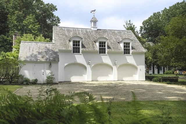 french provincial home featuring a garage