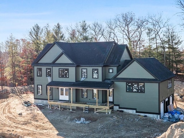 back of house with a garage