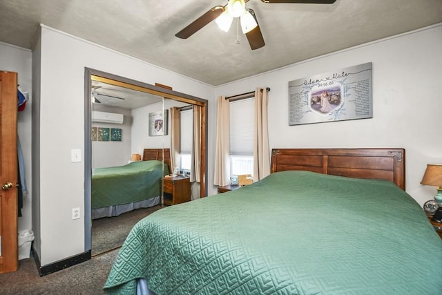 bedroom featuring ceiling fan, dark carpet, a closet, and a wall mounted AC