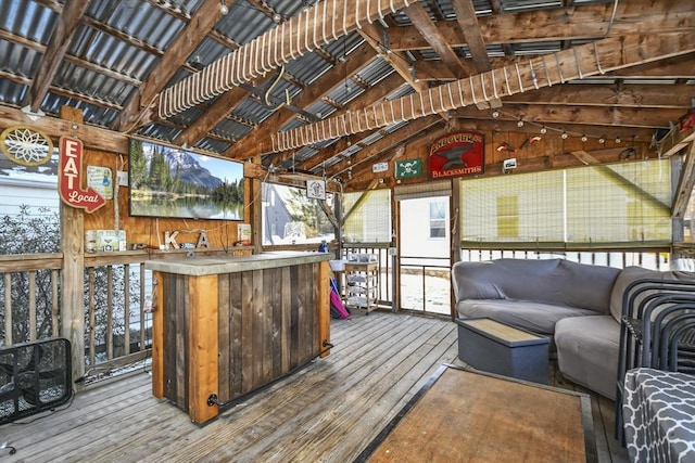 wooden deck with an outdoor hangout area and an outdoor bar