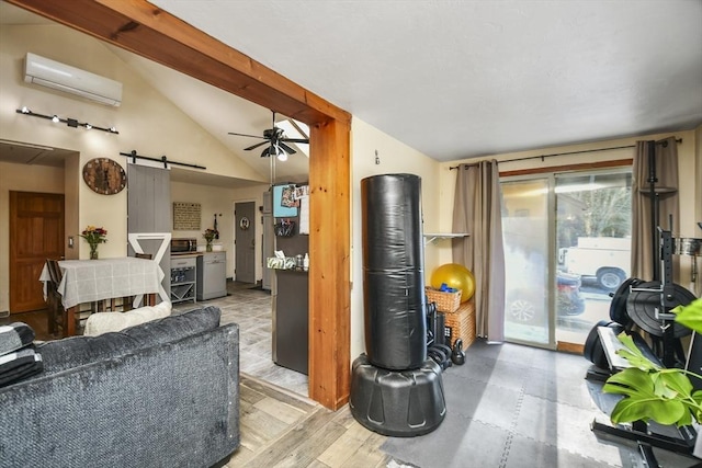 living room with wood-type flooring, a wall unit AC, ceiling fan, a barn door, and vaulted ceiling with beams