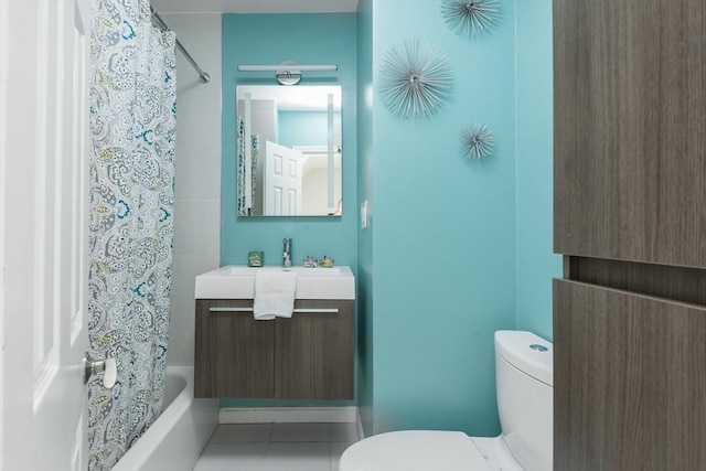 full bath featuring toilet, shower / bath combo with shower curtain, tile patterned flooring, and vanity