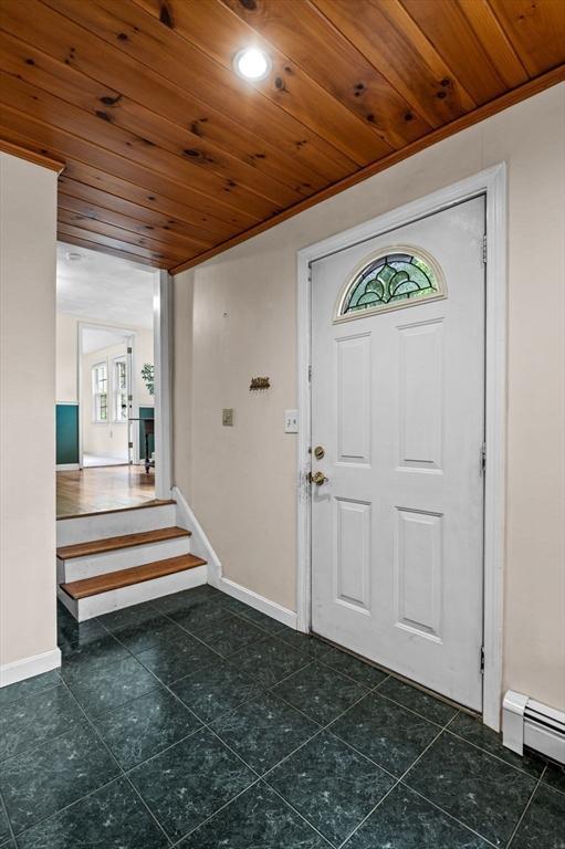 5 Emery Ct, Stoneham, MA 02180 - foyer entrance with baseboards, wooden ceiling, a baseboard heating unit, stairway, and recessed lighting