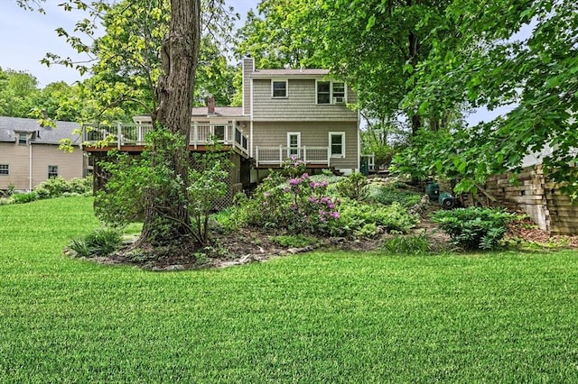 5 Emery Ct, Stoneham, MA 02180 - back of house featuring a chimney, a deck, and a lawn