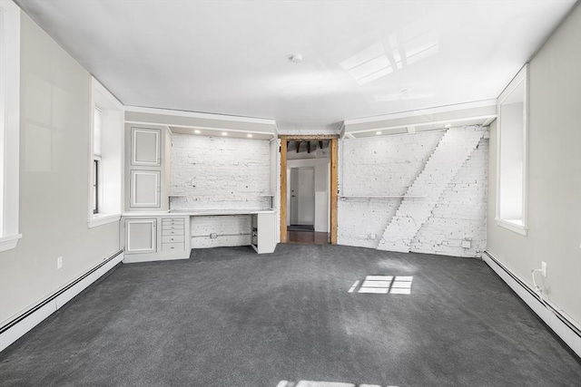 unfurnished living room featuring carpet and a baseboard radiator