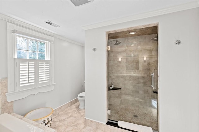 full bathroom featuring a shower stall, visible vents, crown molding, and toilet