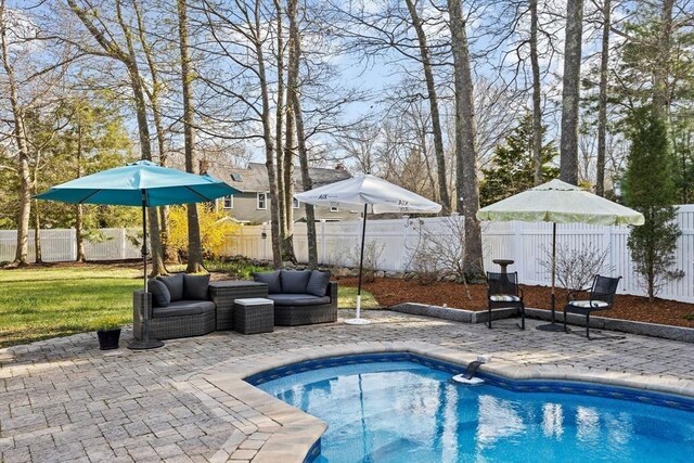 view of swimming pool with a fenced backyard, a fenced in pool, a yard, and a patio