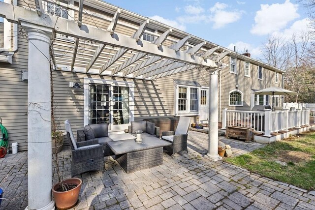 view of patio / terrace featuring a pergola and an outdoor hangout area