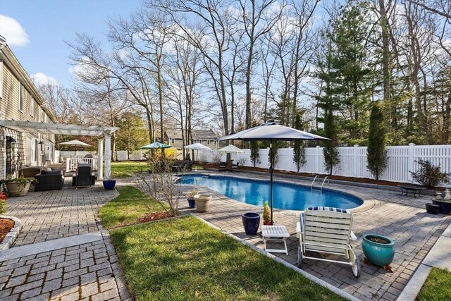 view of swimming pool featuring a pergola, a fenced in pool, a patio, and a fenced backyard