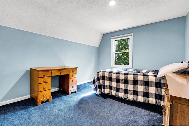 bedroom featuring lofted ceiling, baseboards, dark carpet, and a textured ceiling