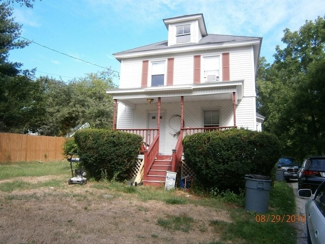 view of front of property featuring covered porch