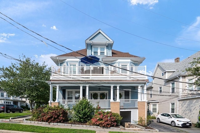 view of front of house with a balcony