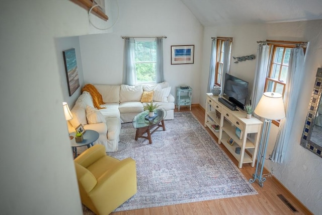 10 Kellies Path, Eastham, MA 02642 - living area with lofted ceiling and wood finished floors