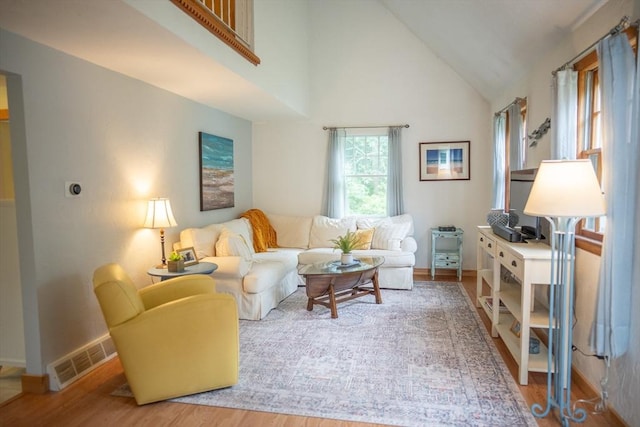 10 Kellies Path, Eastham, MA 02642 - living area featuring wood finished floors and high vaulted ceiling