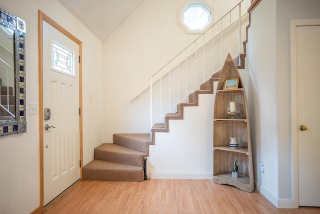 10 Kellies Path, Eastham, MA 02642 - foyer with stairway, wood finished floors, and lofted ceiling
