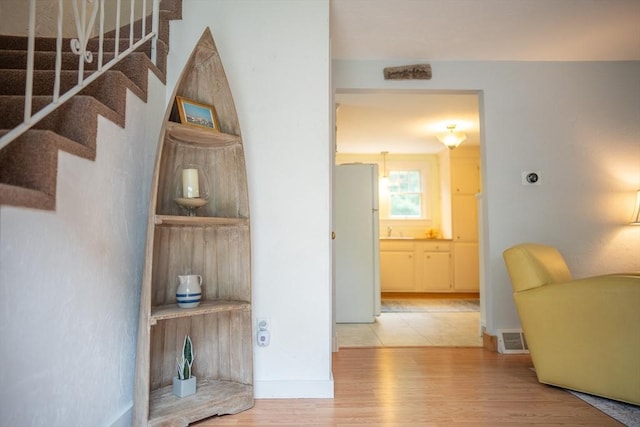 10 Kellies Path, Eastham, MA 02642 - corridor with stairs and light wood-type flooring
