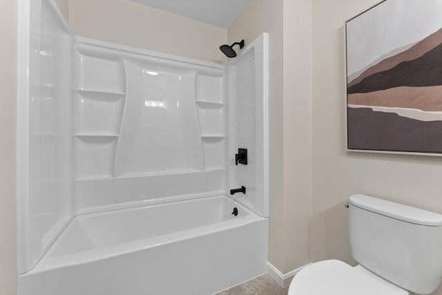 full bath featuring toilet, baseboards, and shower / washtub combination