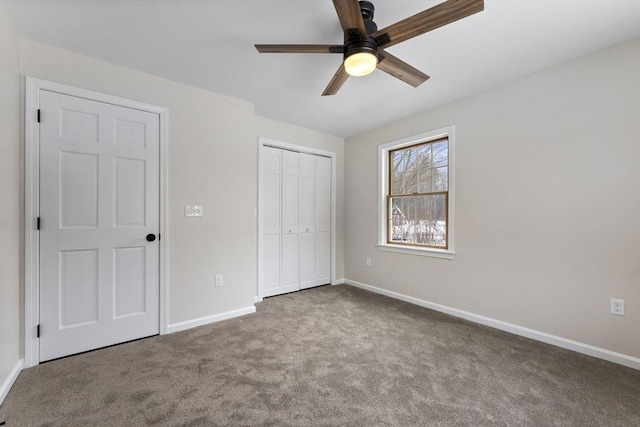 unfurnished bedroom with carpet floors, baseboards, and a closet