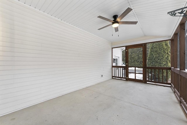 unfurnished sunroom featuring a ceiling fan