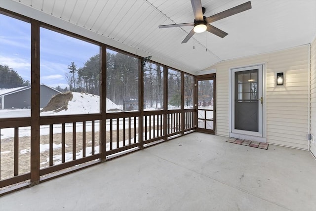 unfurnished sunroom with vaulted ceiling and ceiling fan