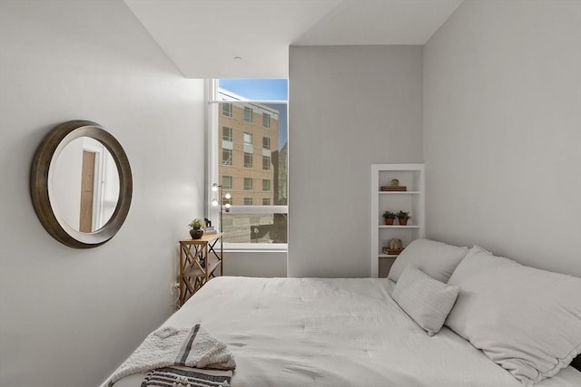 bedroom featuring floor to ceiling windows