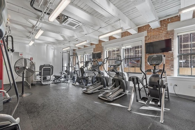 exercise room with brick wall