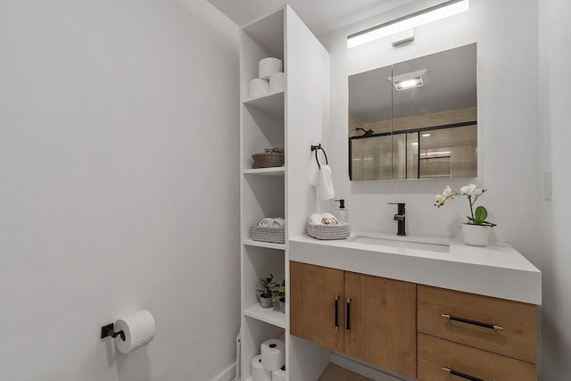 full bath with a stall shower and vanity