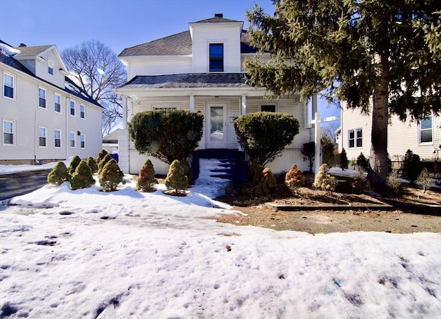 view of front of property with a garage and covered porch