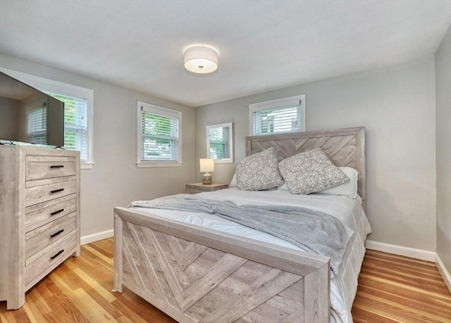 277 Ridgewood Dr, Norwood, MA 02062 - bedroom featuring light wood-type flooring and baseboards