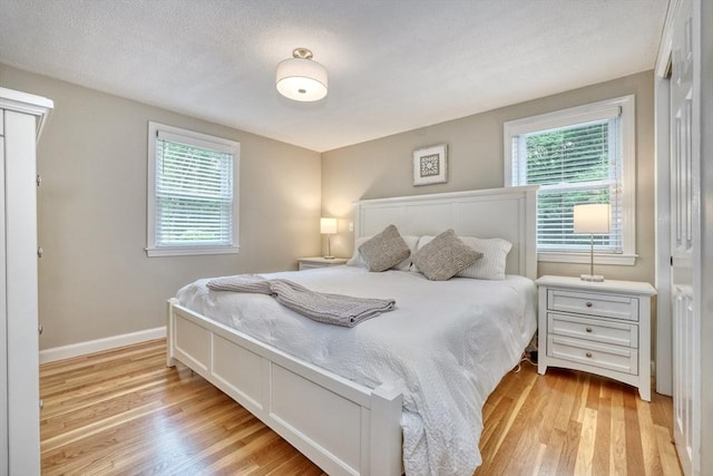 277 Ridgewood Dr, Norwood, MA 02062 - bedroom with light wood-type flooring and multiple windows