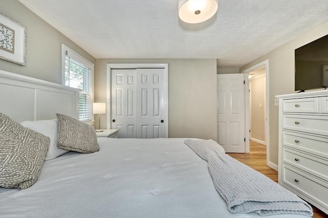 277 Ridgewood Dr, Norwood, MA 02062 - bedroom featuring a closet and wood finished floors