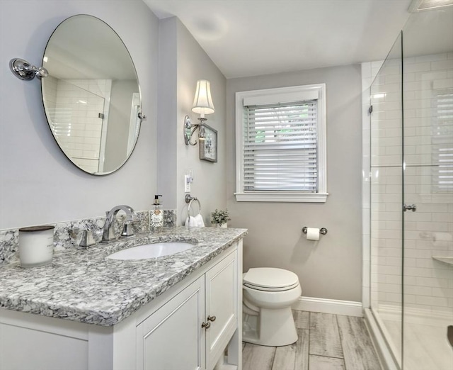 277 Ridgewood Dr, Norwood, MA 02062 - bathroom featuring vanity, a stall shower, and wood finished floors