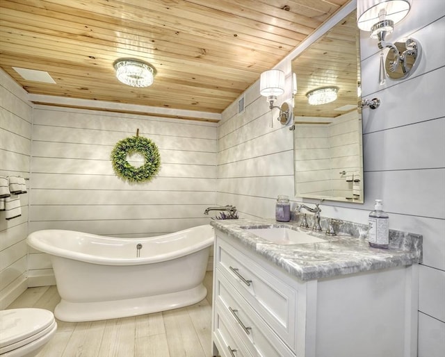 277 Ridgewood Dr, Norwood, MA 02062 - bathroom featuring wood ceiling, vanity, and a freestanding tub