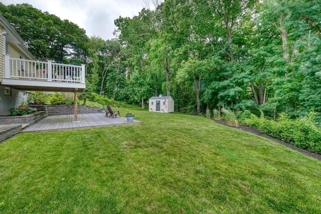 277 Ridgewood Dr, Norwood, MA 02062 - view of green lawn with a storage shed and a wooden deck